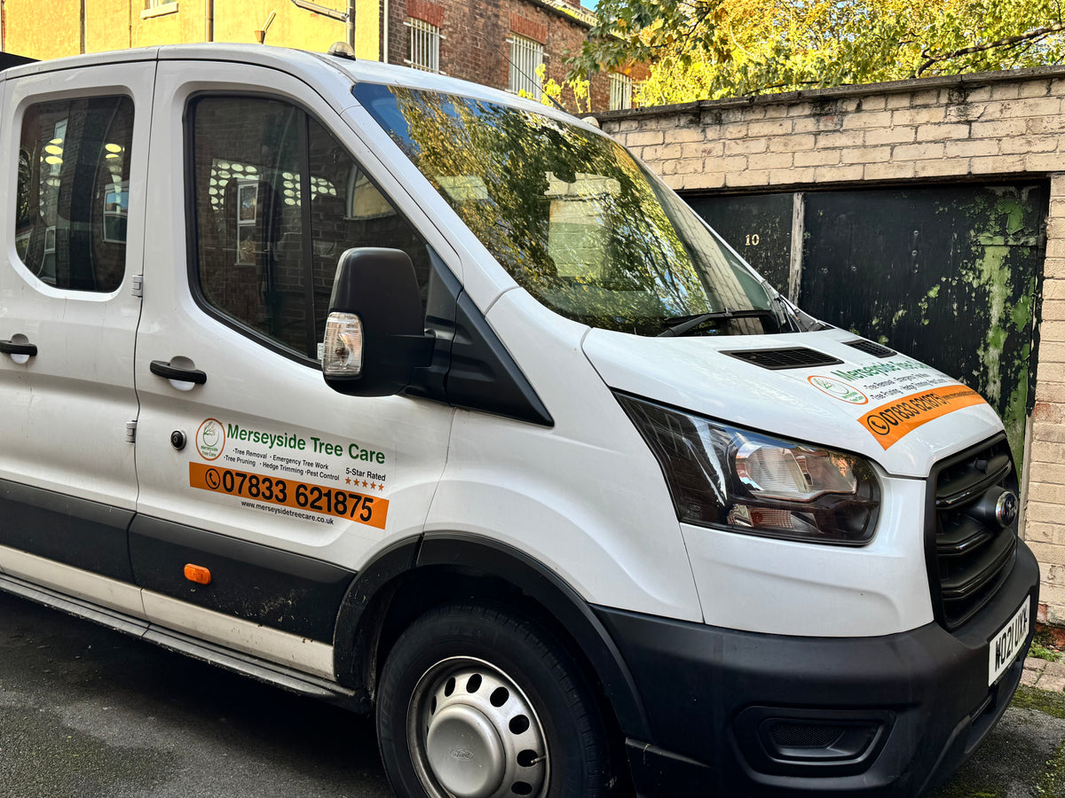 Branded Merseyside Tree Care truck parked on a local job site in Liverpool, providing professional tree surgery and green waste removal.